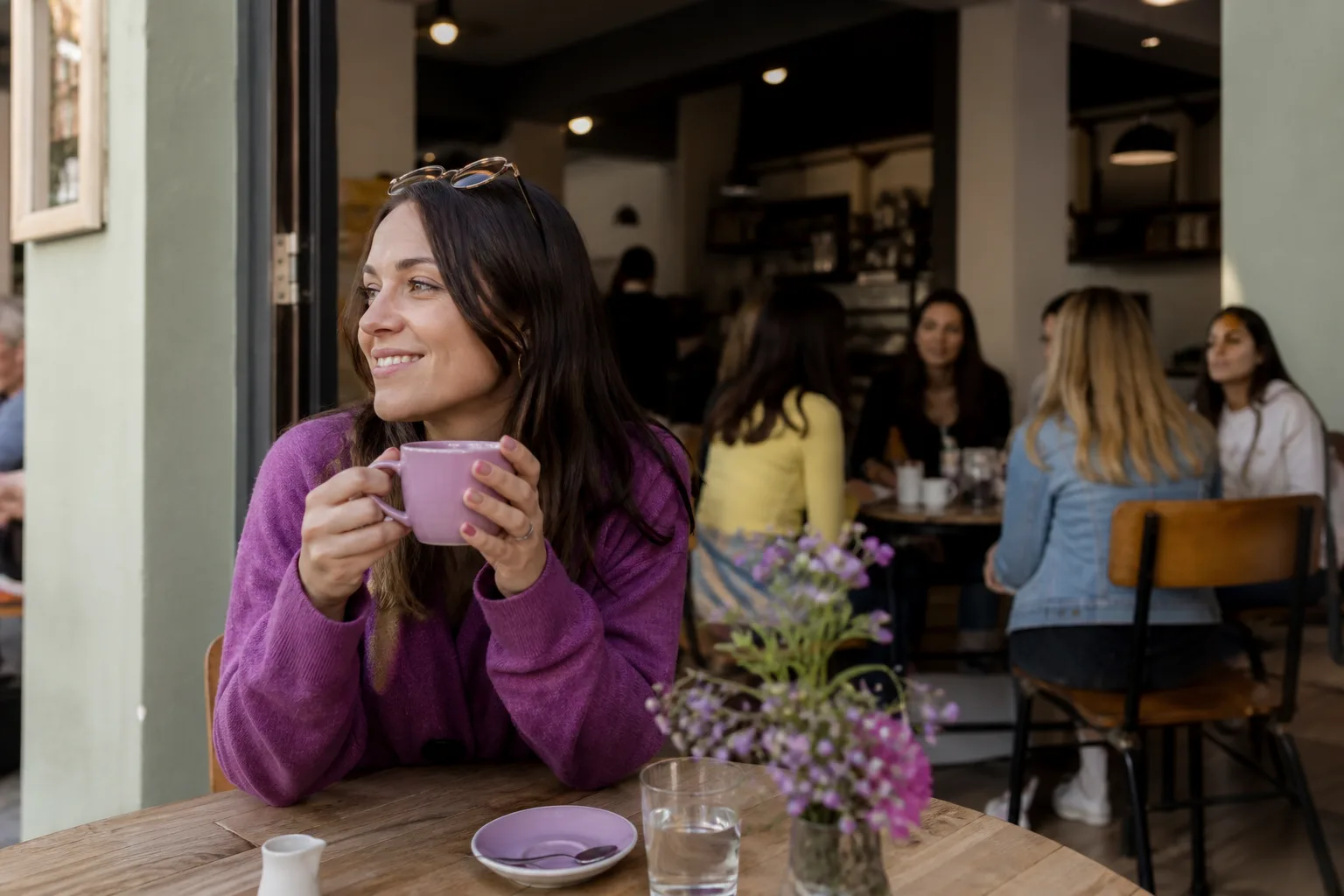 Woman enjoying coffee by the waterfront in Strathclyde